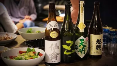 Bottles of sake atop a dinner table