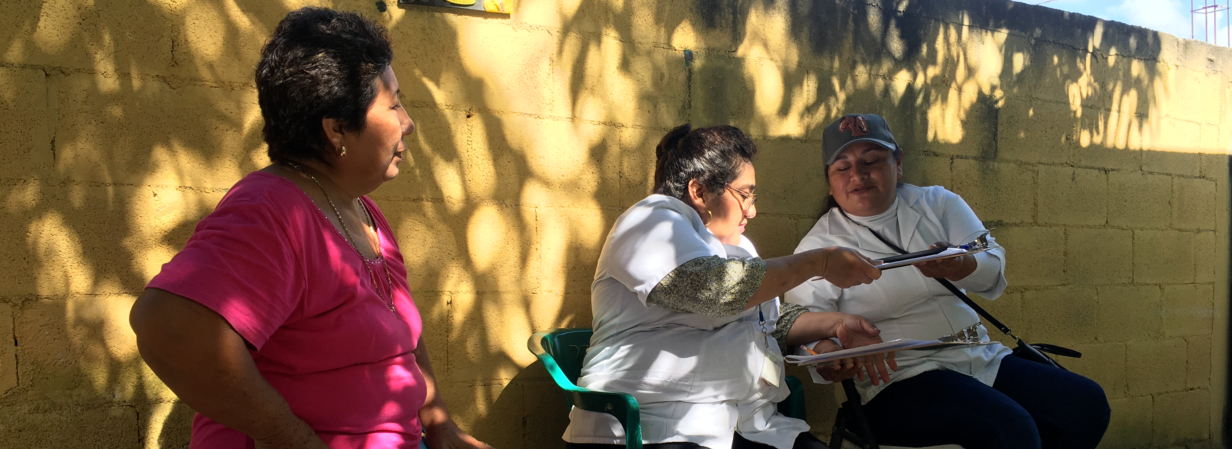 data collectors reviewing information on a clipboard