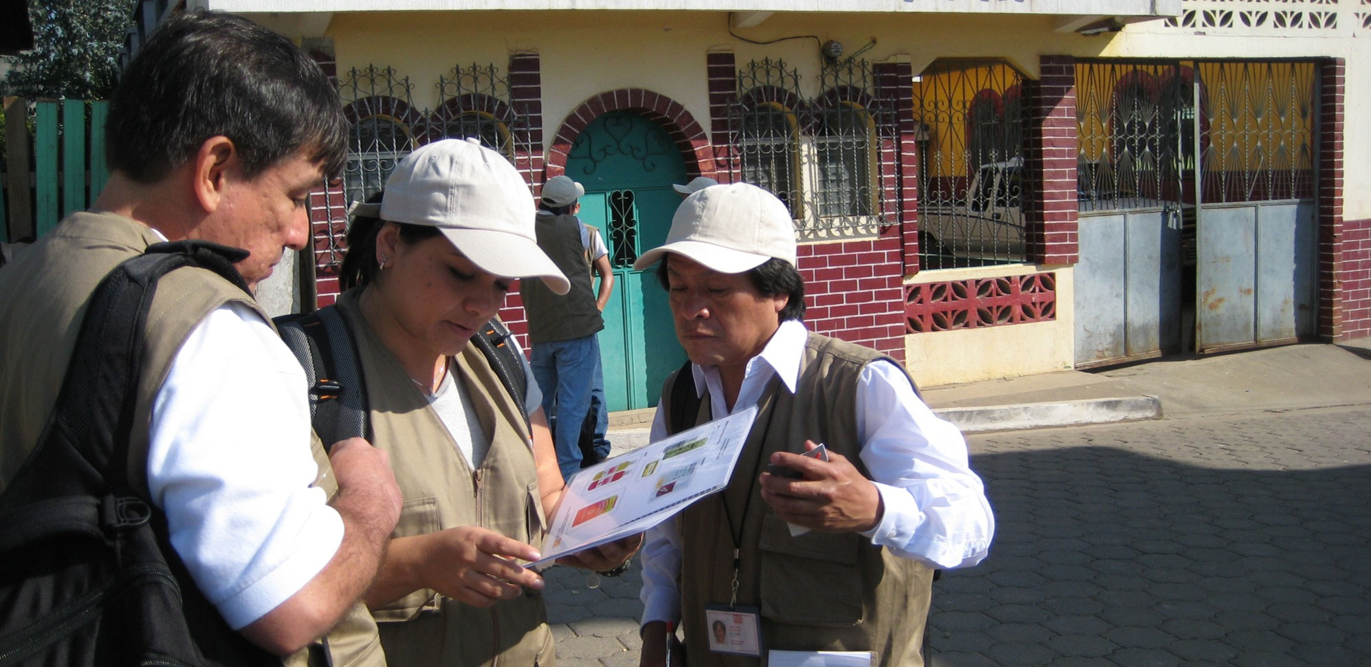 data collectors review survey information on a clipboard 