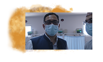 Dr. Dhimal wearing a mask in a hospital