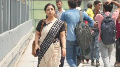 Dr. Anamika Pandey walks down a busy street in India