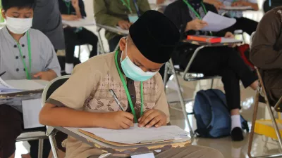 students wearing masks in a classroom