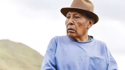 elderly Native American man looks into distance