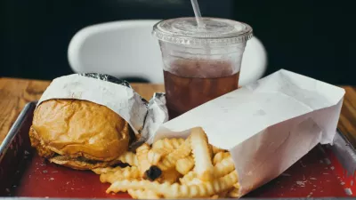 tray with hamburger, french fries, and soda