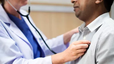 doctor uses stethoscope on a man's chest