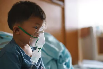child uses an oxygen mask